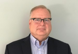 Michael Jacques in glasses and black jacket